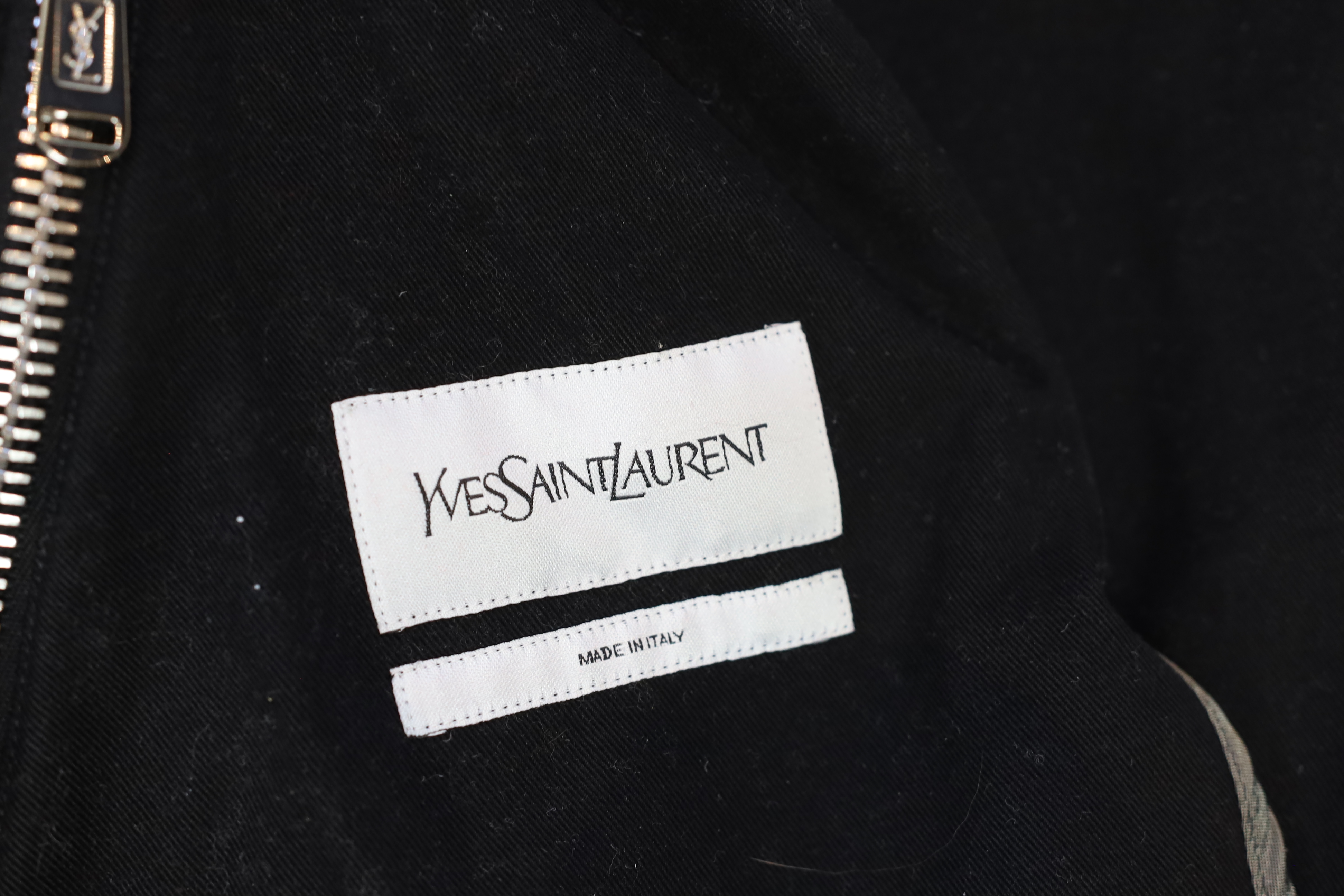 A vintage Yves Saint Laurent lady's hooded black double zipped bomber jacket, size 10-12